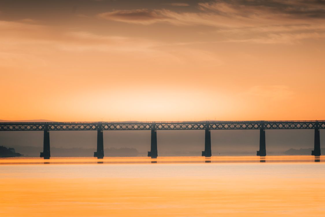 Dramatic Orange Sunset Over Scottish Railway Bridge · Free Stock Photo