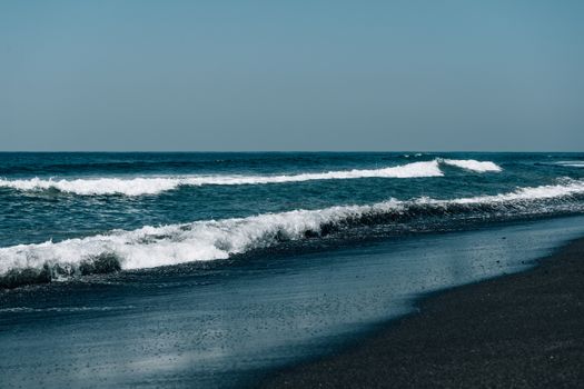 A calming view of waves breaking on a tranquil beach, perfect for nature enthusiasts.