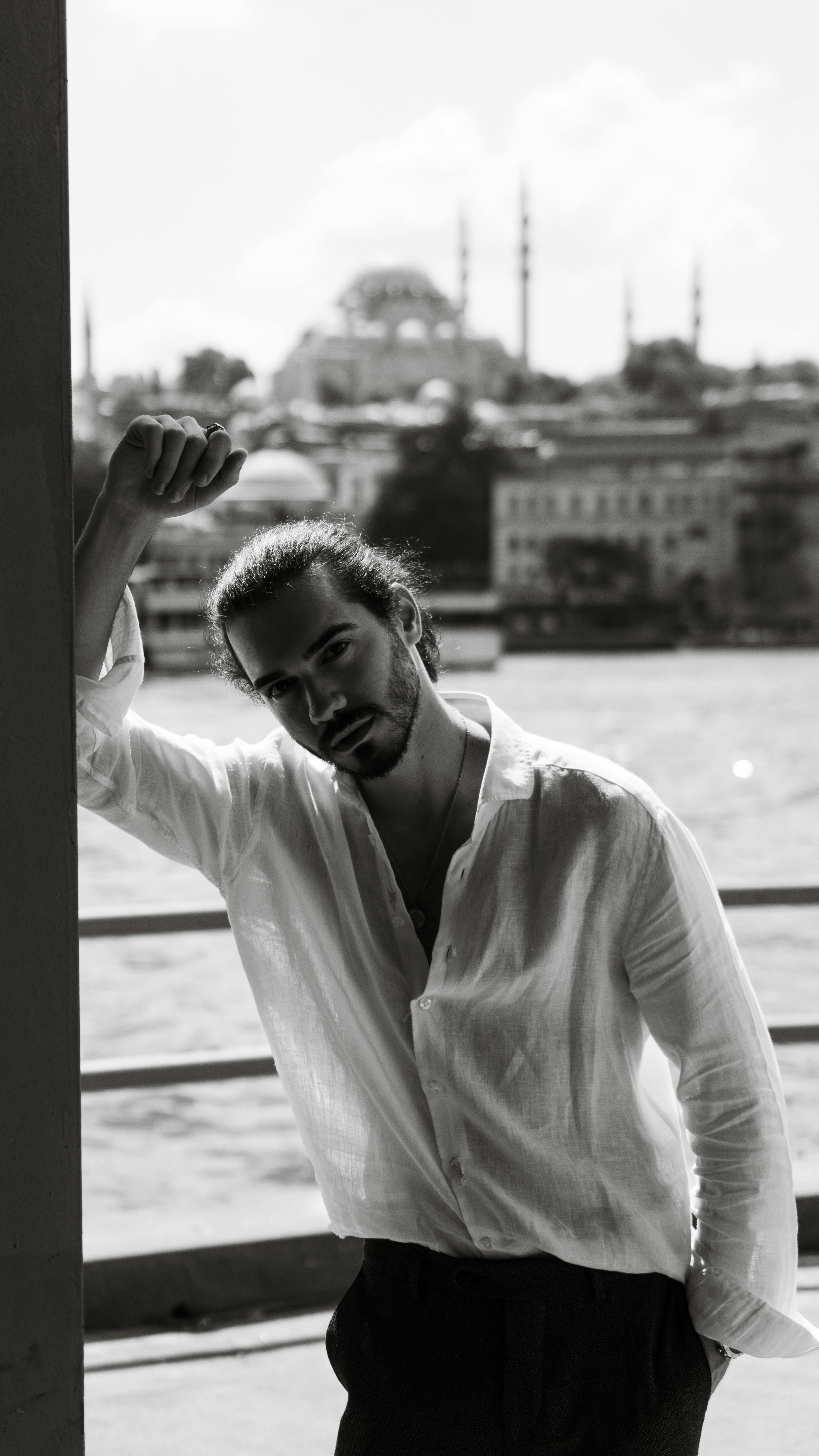 Black and white portrait of a man by the waterfront in İstanbul.