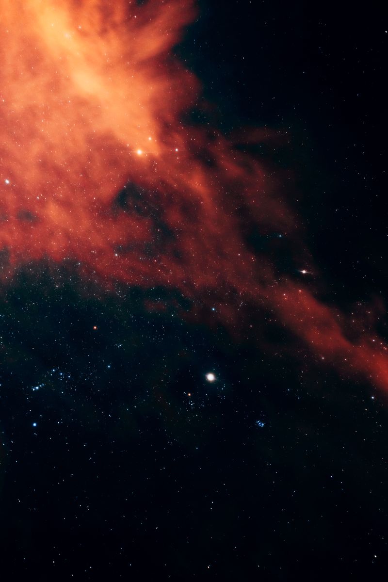 Stunning image of a nebula and starfield, capturing the vibrant hues of deep space.