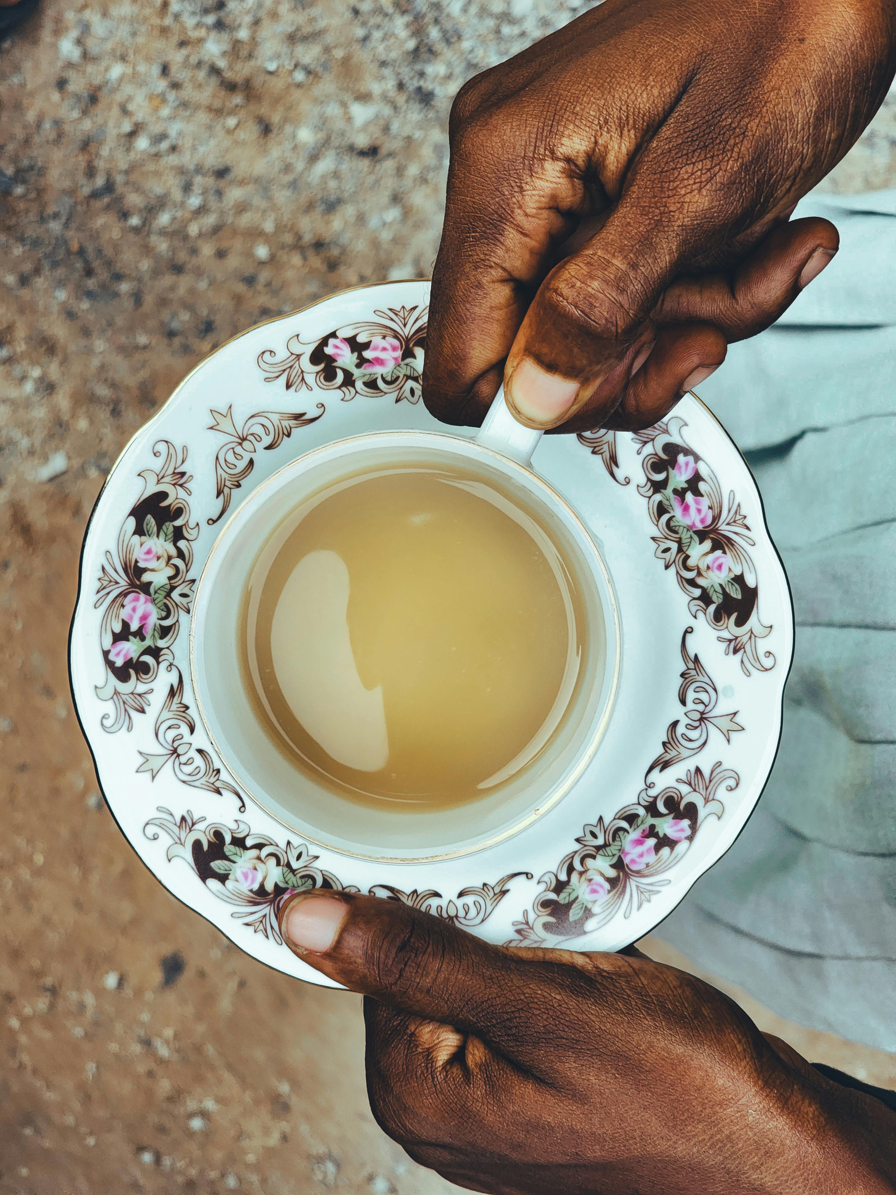 elegant tea holding in ornate cup