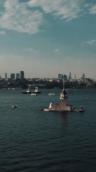 Beautiful aerial view of Maiden's Tower in the Bosphorus Strait, İstanbul, capturing the serene cityscape.