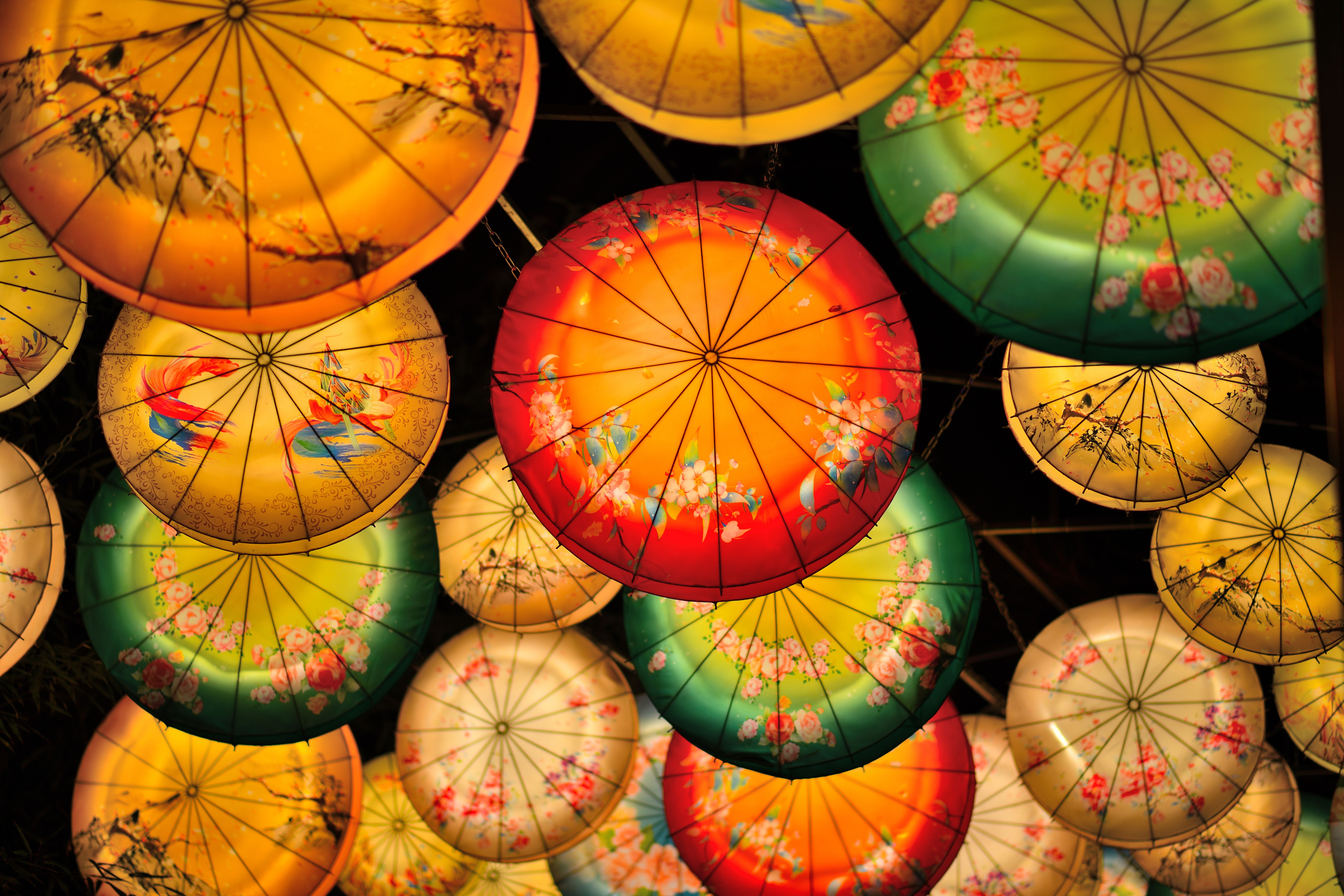 Free Colorful decorative lanterns create a vibrant atmosphere during an Asian lantern festival at night. Stock Photo