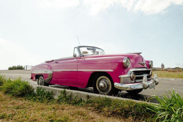 Vibrant pink vintage convertible car — pink limo rental NYC