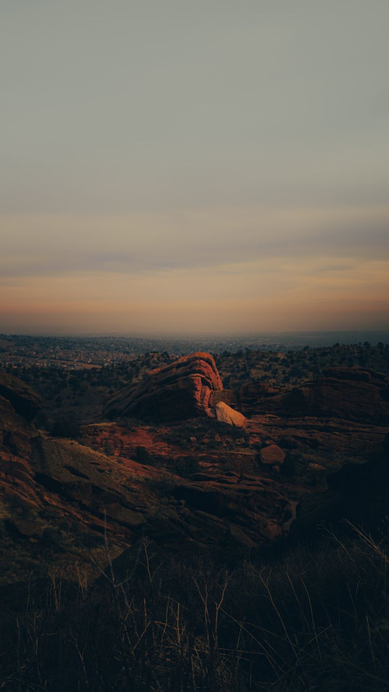Sunset over the red rock formations at Red Rocks Amphitheatre in Colorado