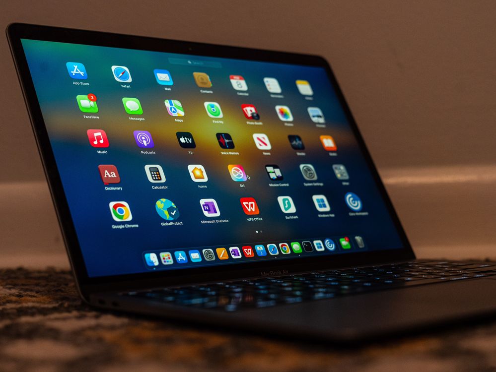 Computer Applications On Screen Sleek Laptop Display with Various Applications · Free Stock Photo