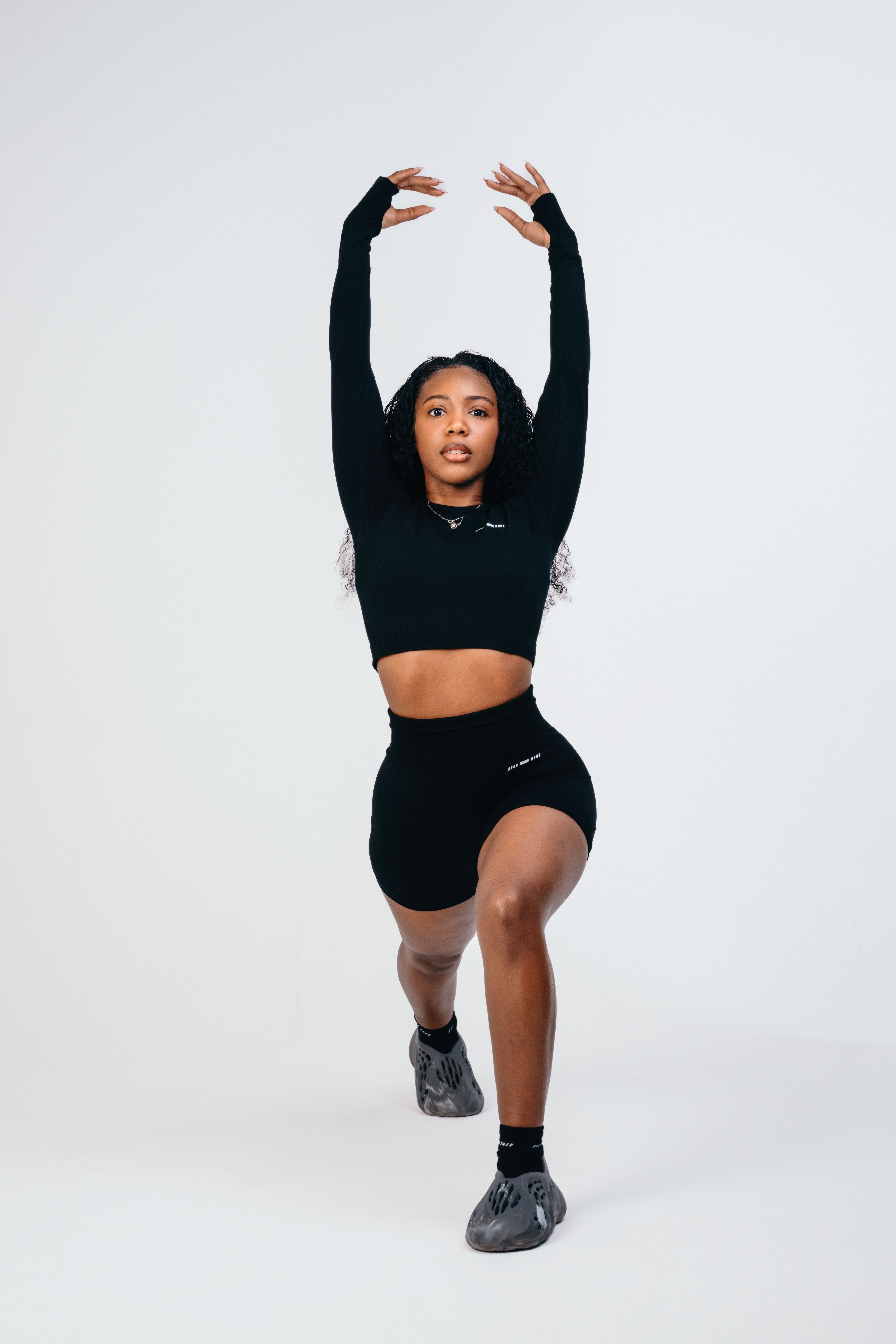 Elegant Fitness Model Posing in Studio · Free Stock Photo