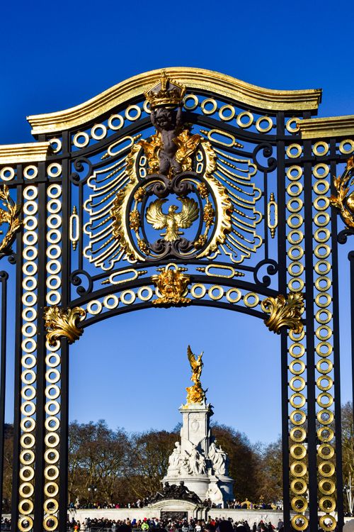 Free Close-up of ornate gates with Victoria Memorial in background, London. Stock Photo