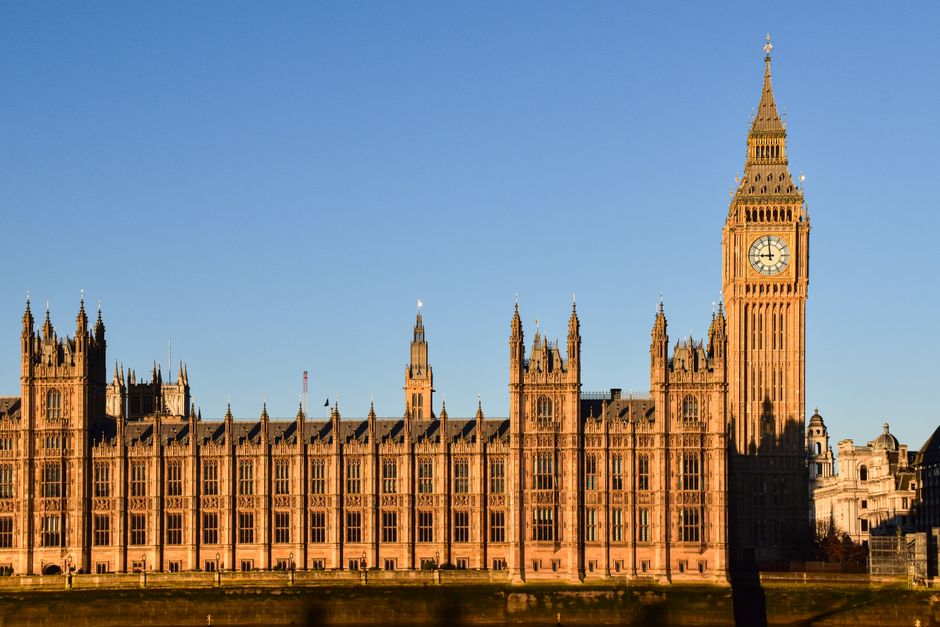A stunning view of the iconic Big Ben and Westminster Palace during sunset in London.
