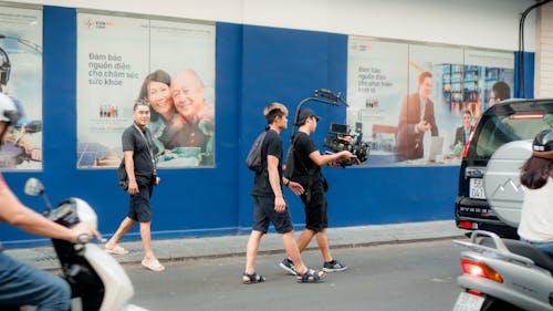Photo Of Camera Crew Walking On Road