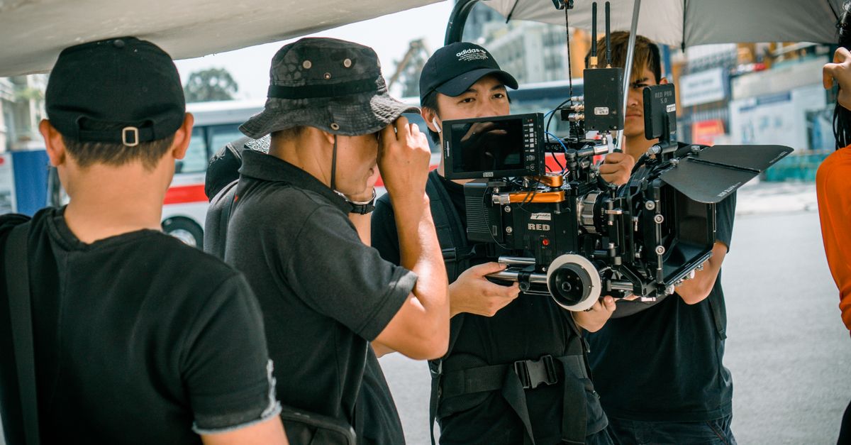 Photo Of Camera Crew Standing Near Each Other · Free Stock Photo