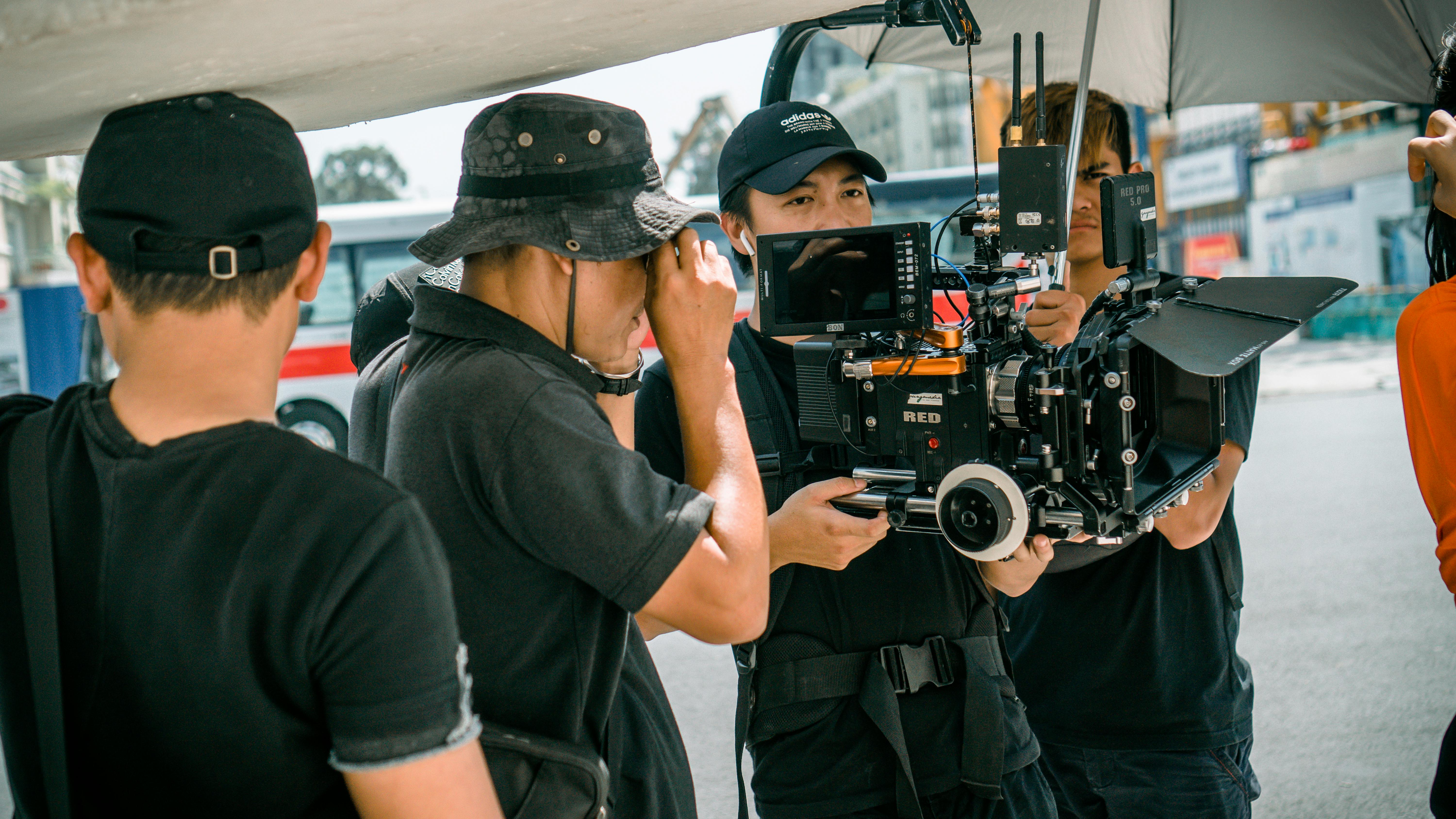 photo-of-camera-crew-standing-near-each-other-free-stock-photo