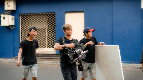 Photo Of Camera Crew Walking On Road