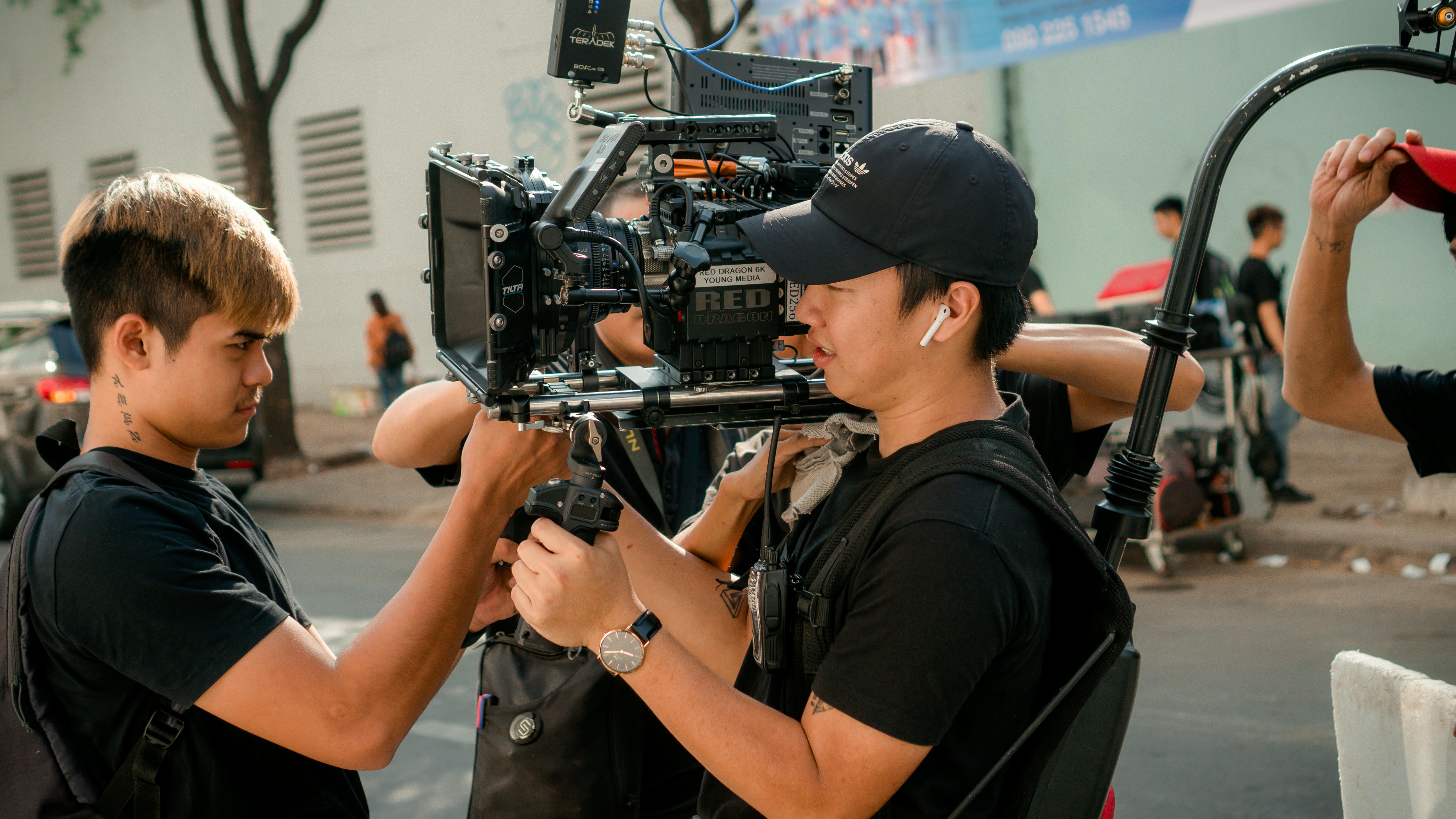 photo of men holding camera