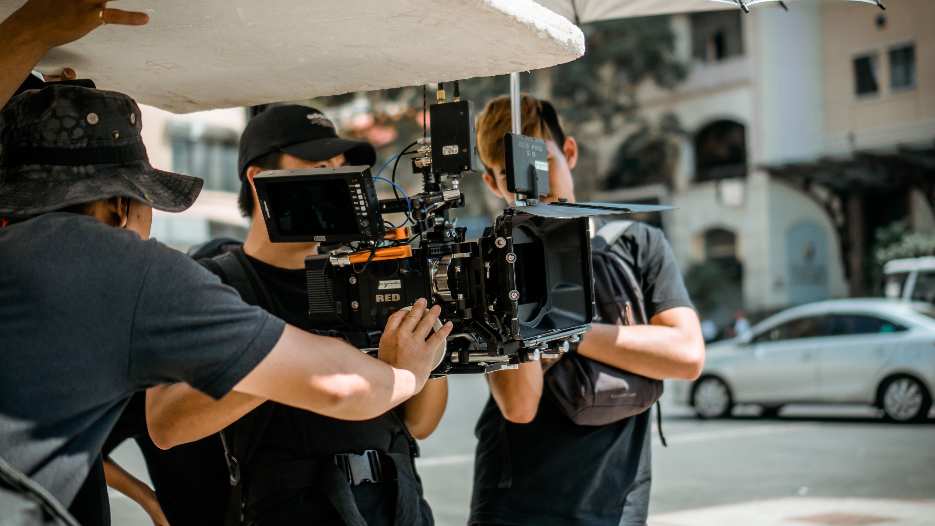 Professional video production crew setting up cameras for a live event