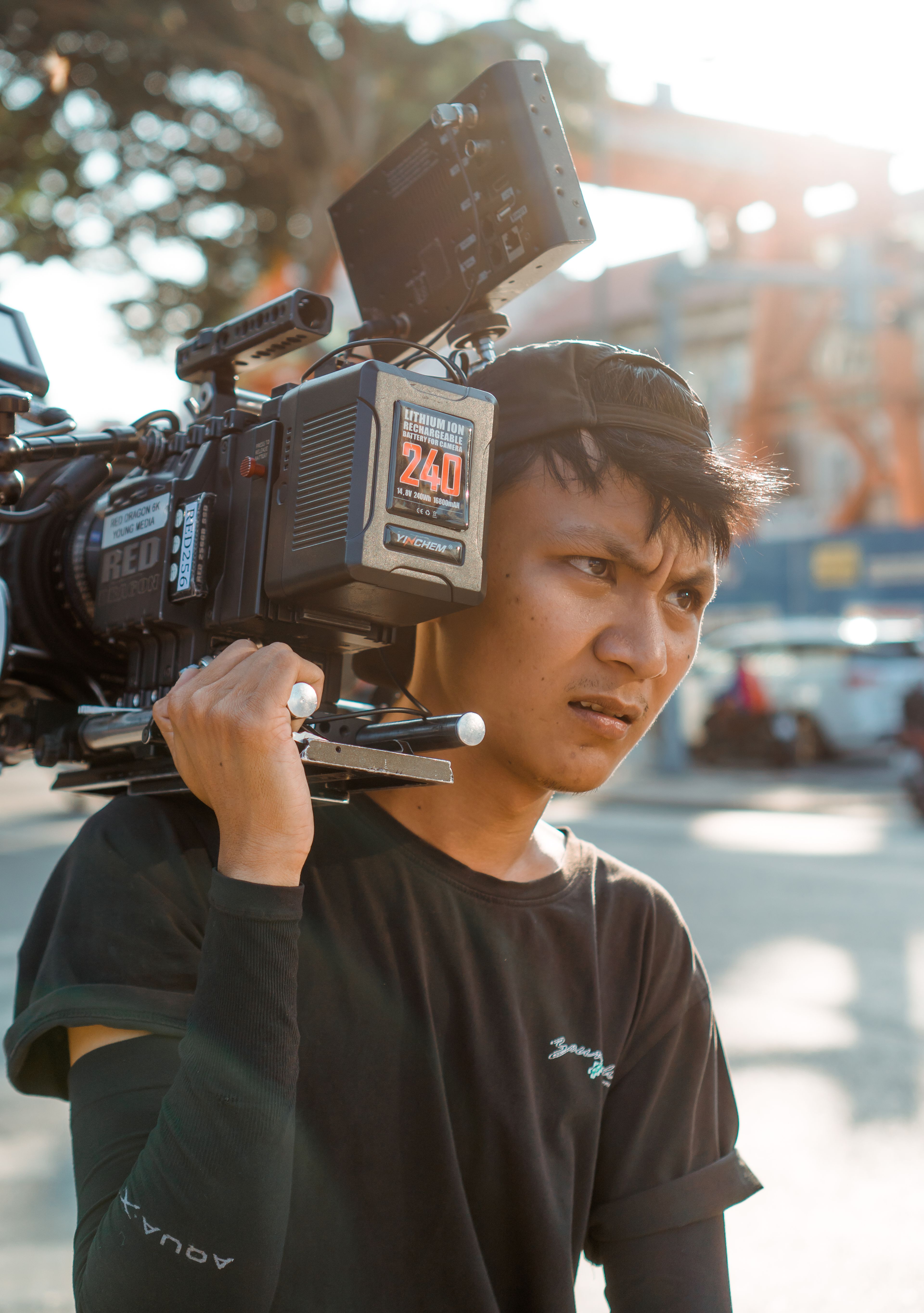 A camera on the shoulder, on the street