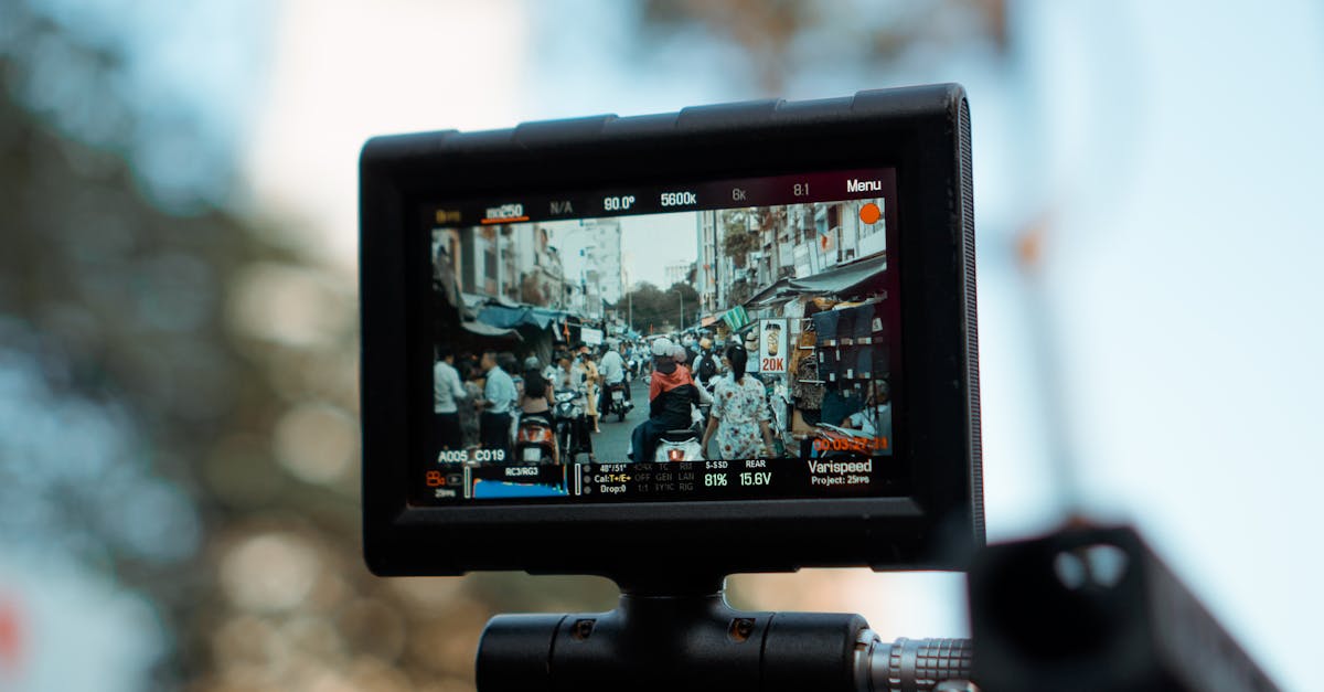 Photo by Lê Minh Close-up of a camera monitor showing a bustling street market scene in daylight.