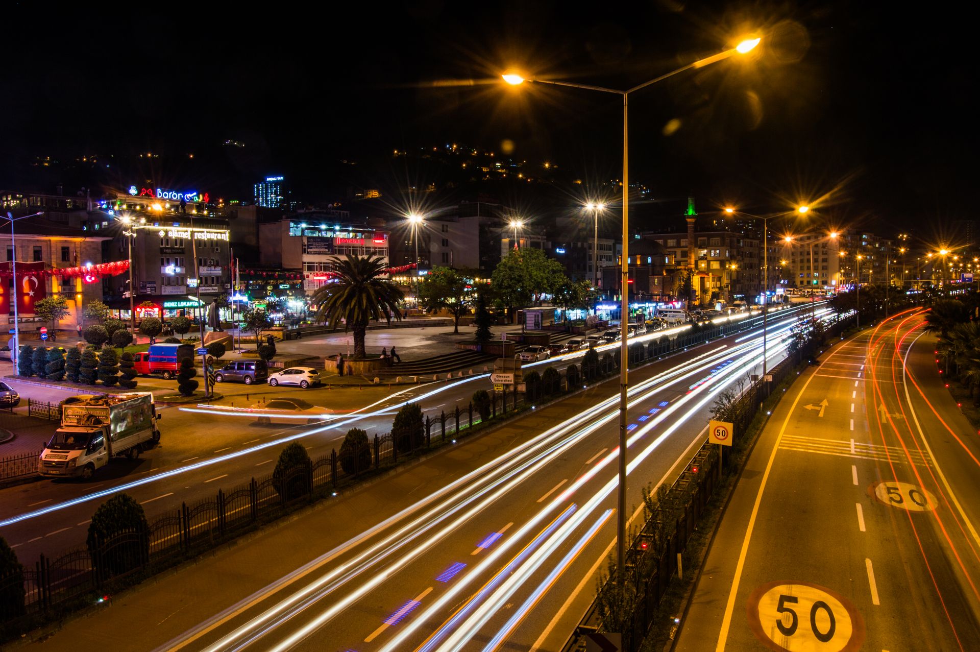 Long exposure night shot showcasing bustling traffic in Giresun, Türkiye.