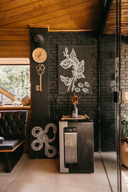 Stylish interior featuring unique art pieces and a modern mini-fridge in Espírito Santo, Brazil.