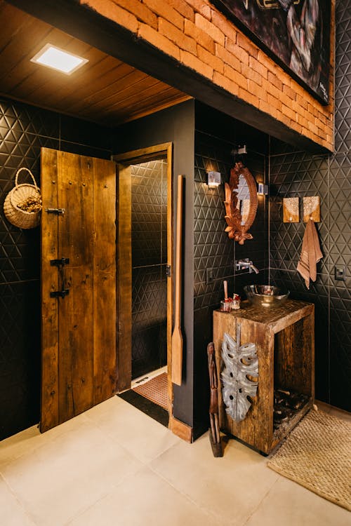 Free A rustic bathroom interior featuring wood and brick elements in Espírito Santo, Brazil. Stock Photo