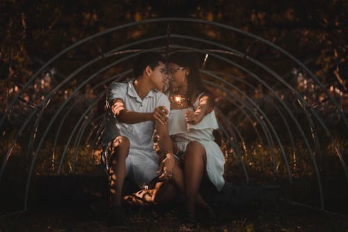 Free Photo Of Couple Holding Sparklers Stock Photo