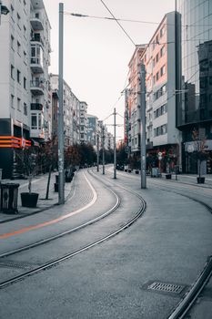 Curved tramway and urban street view with modern buildings in Eskişehir, Türkiye.