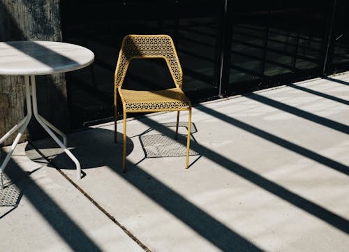 Round Table Near Green Metal Chair