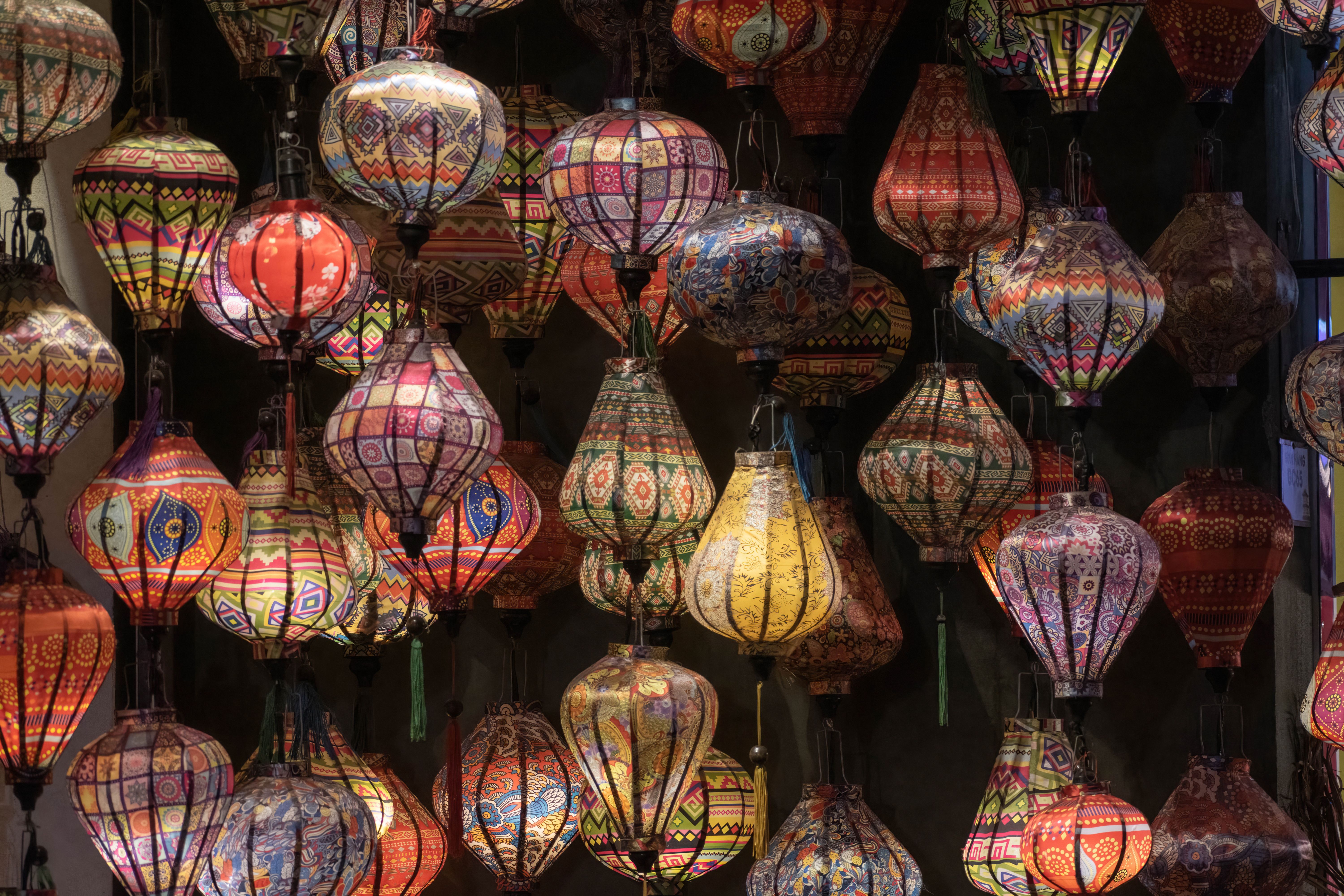 Colorful mosaic lanterns create a vibrant and artistic visual display.