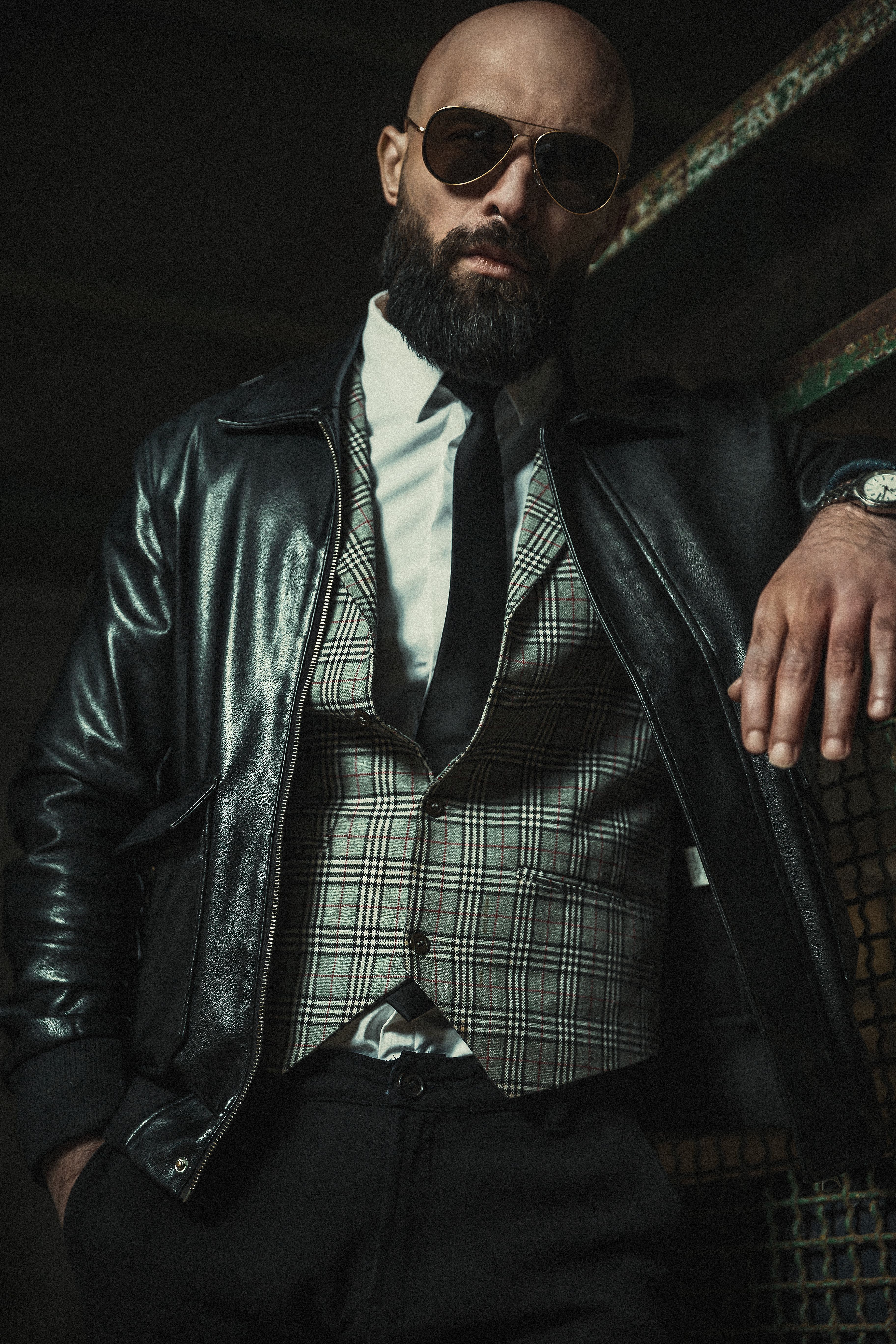 Stylish Man in Leather Jacket Posing Indoors · Free Stock Photo