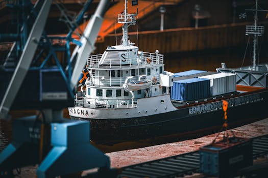 A cargo ship docked at a port loaded with containers, showcasing maritime transport.