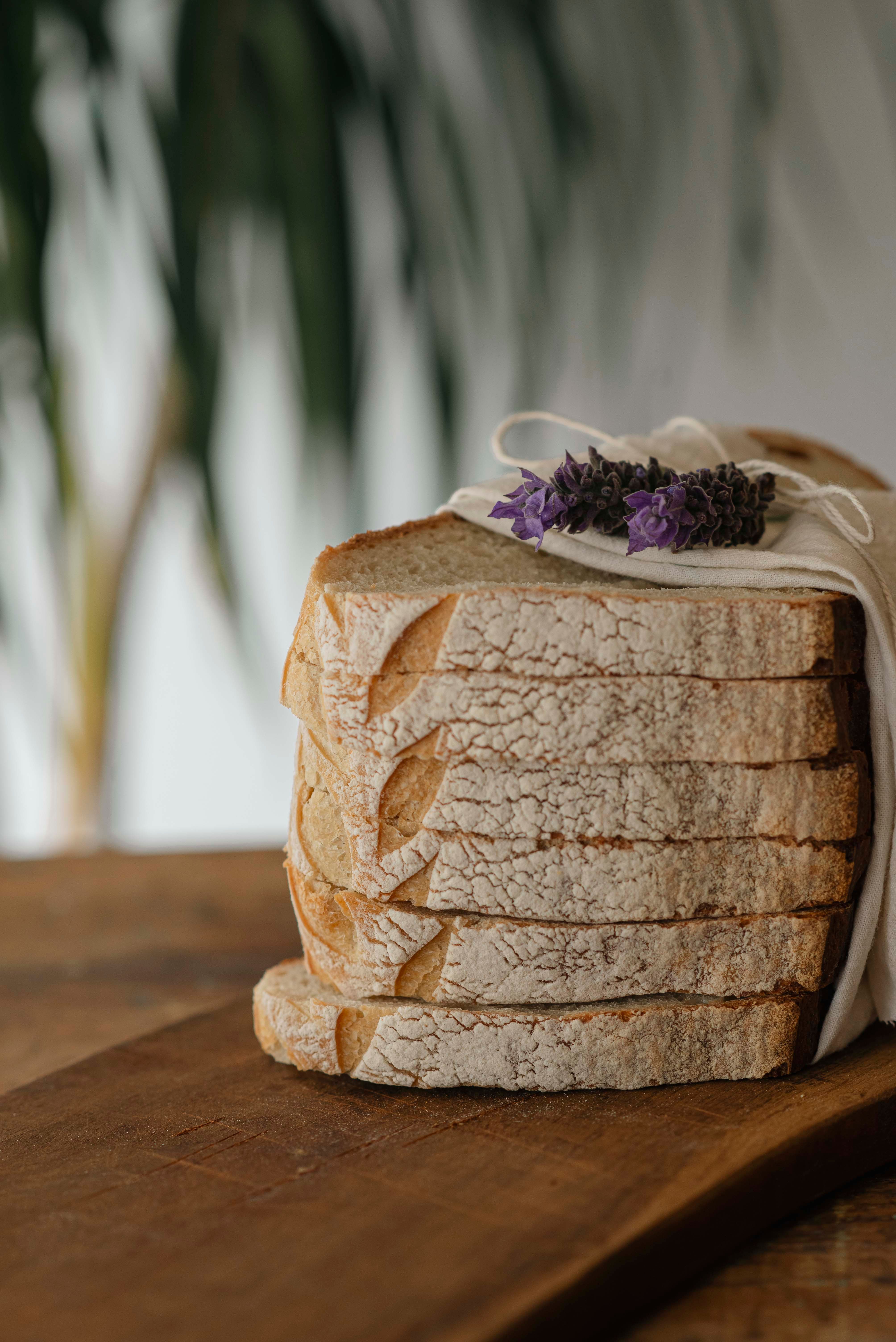 Sliced Artisan Bread with Lavender Garnish · Free Stock Photo