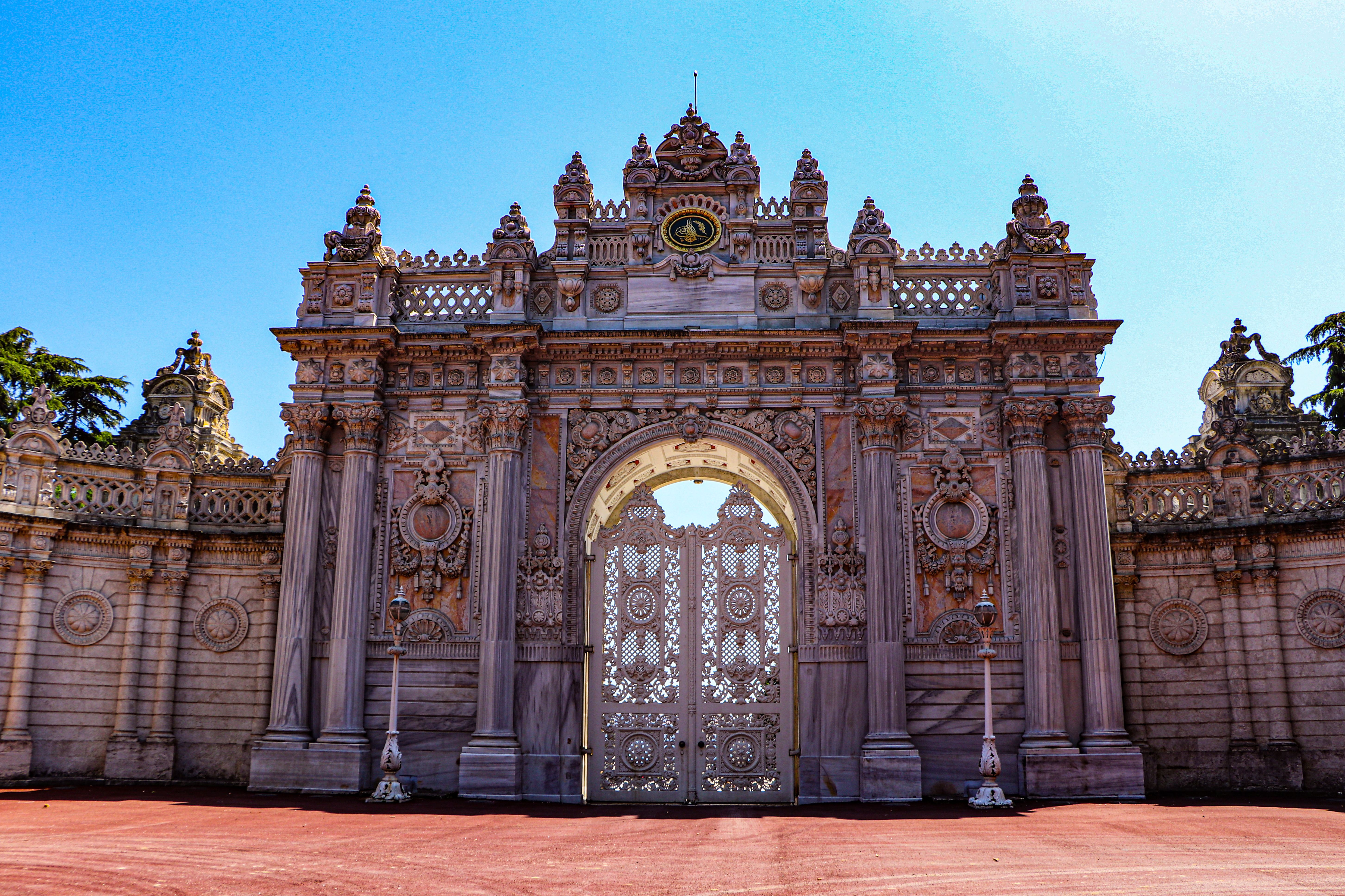Ornate gate of Dolmabahçe Palace in Istanbul, showcasing intricate architecture.