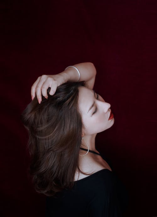 Photo Of Woman Touching Her Hair