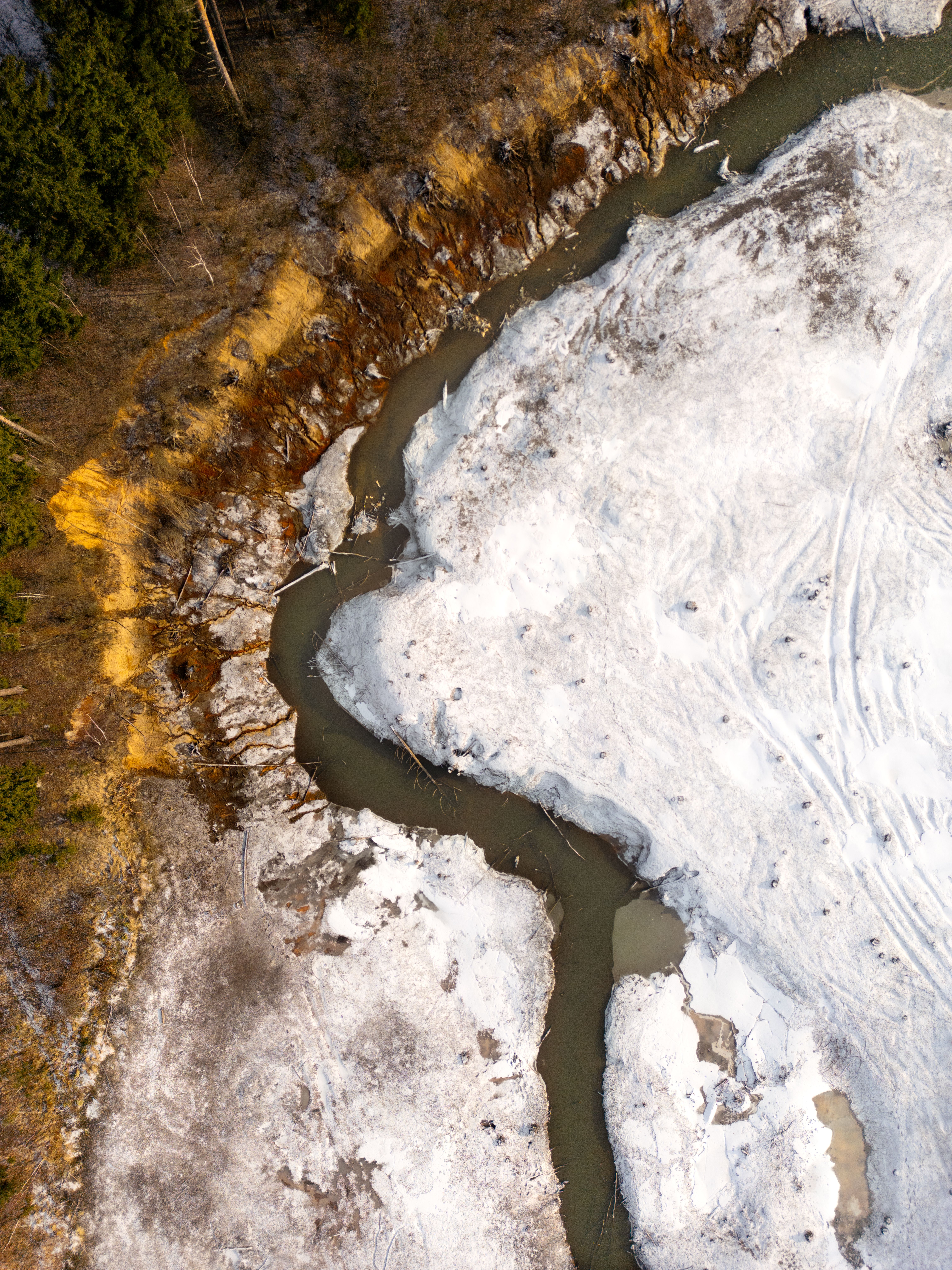 Aerial View of Snow-Covered Landscape with River · Free Stock Photo