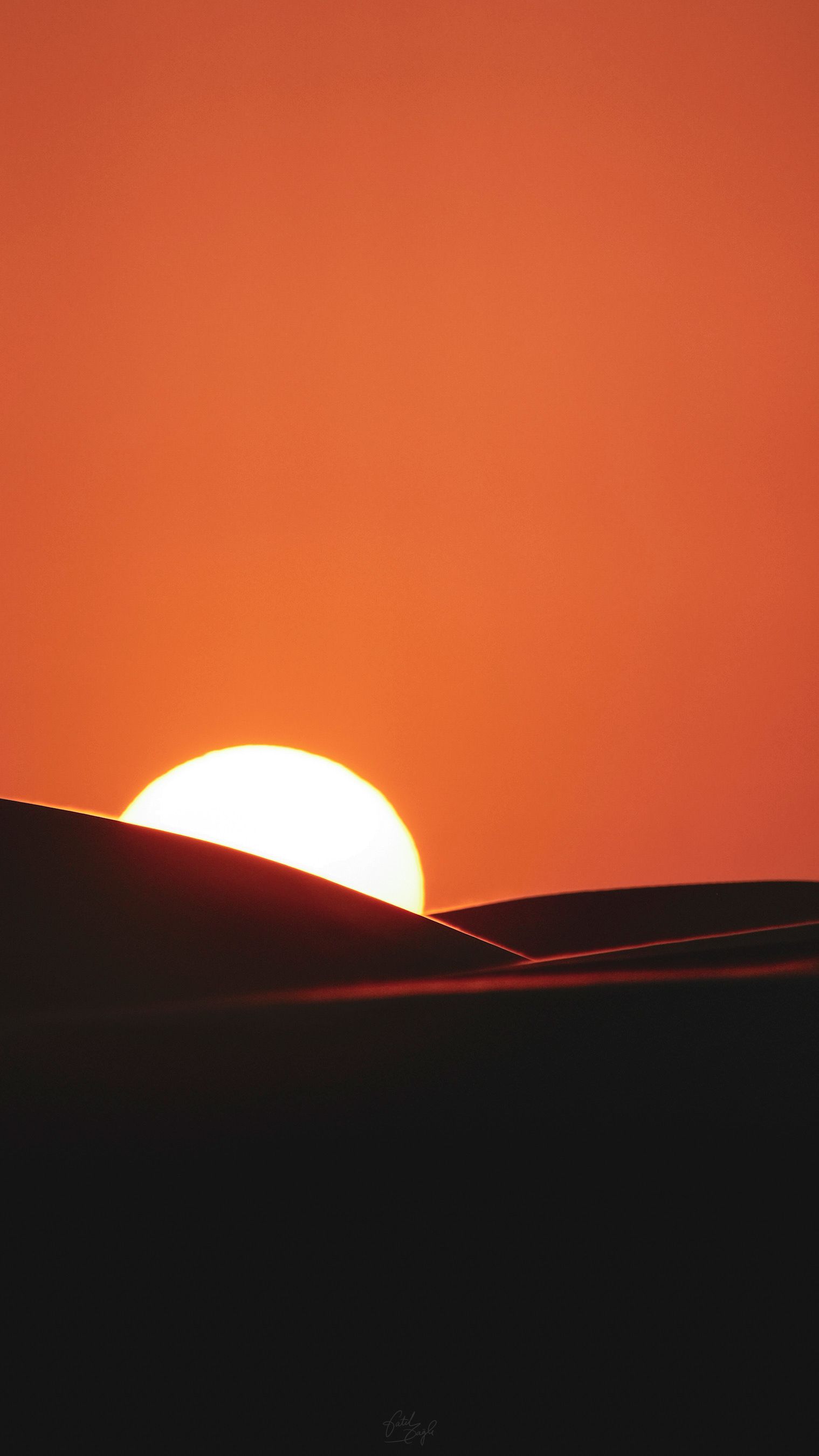 Desert sunset over golden sand dunes in southern Morocco