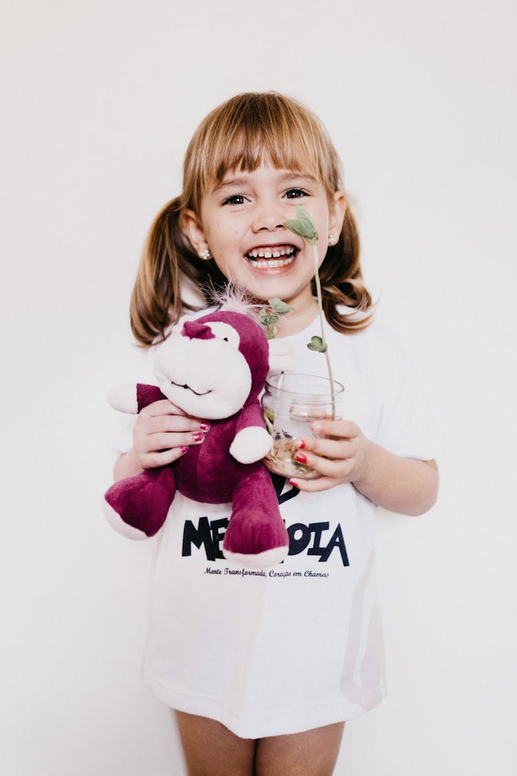 Photo Of Child Holding Stuffed Toy