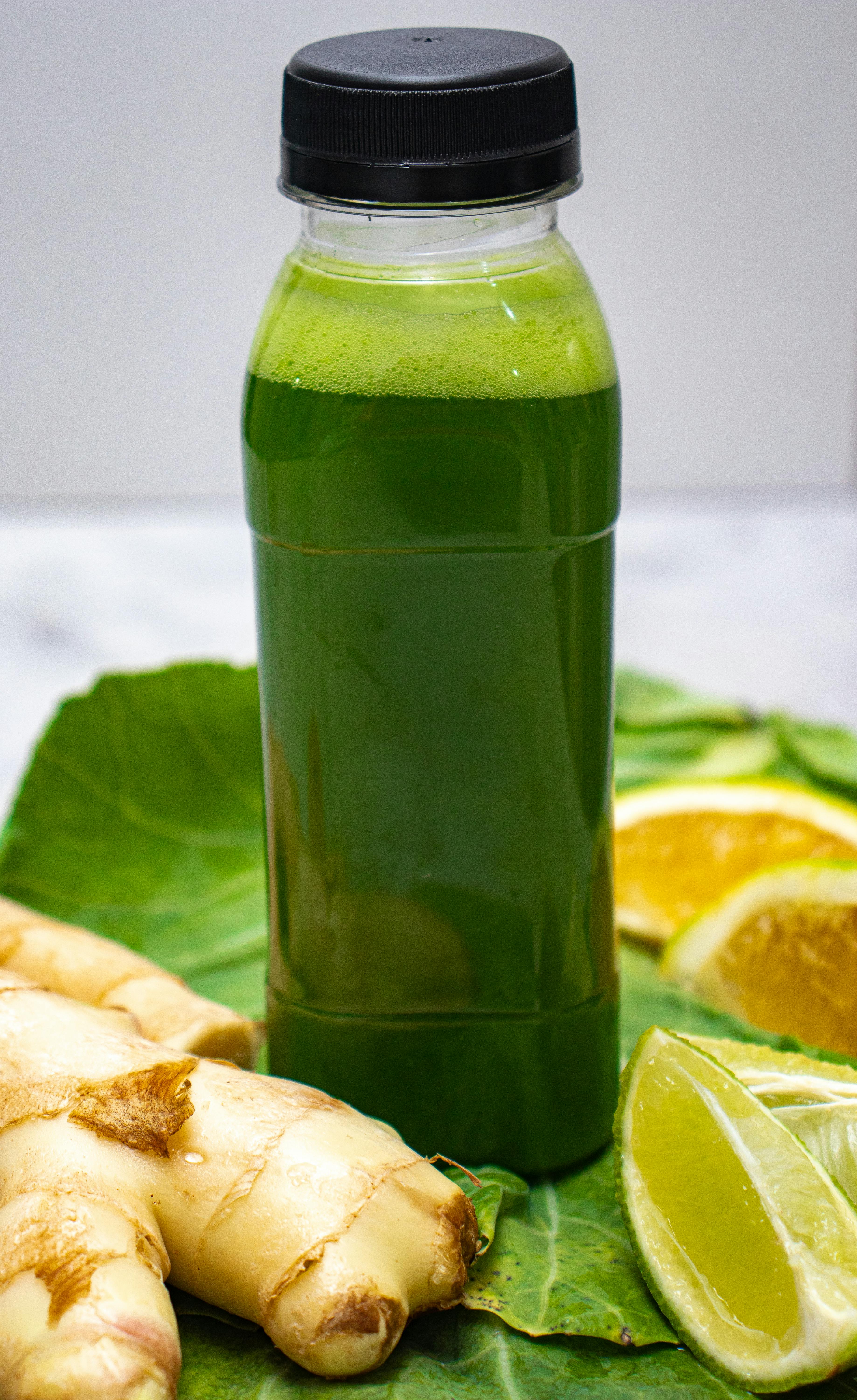 Healthy green juice with ginger and lime, perfect for a refreshing detox.