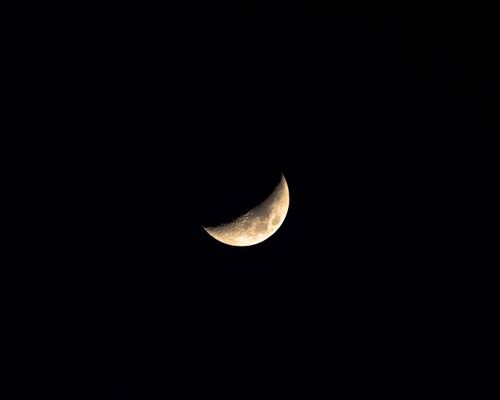 Free A bright crescent moon shining in the vast Chattanooga night sky. Stock Photo