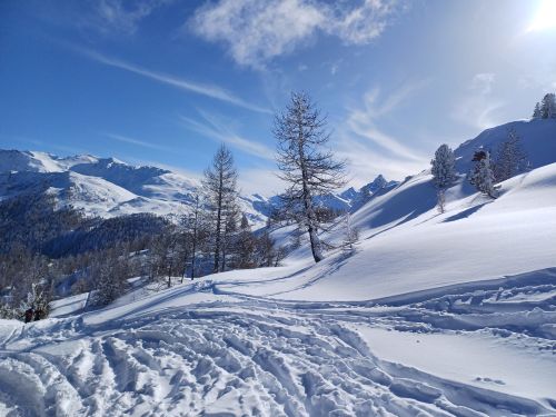 Free Breathtaking view of snowy alpine mountains under a clear blue sky. Stock Photo