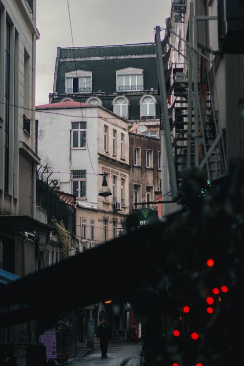 Free Explore the moody twilight ambiance of an Istanbul alleyway with historic architecture. Stock Photo