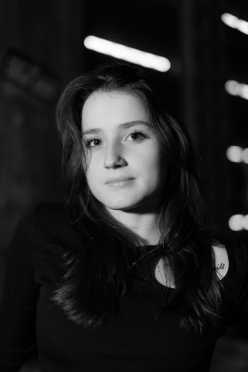 Free Moody black and white portrait of a young Caucasian woman with long hair. Stock Photo