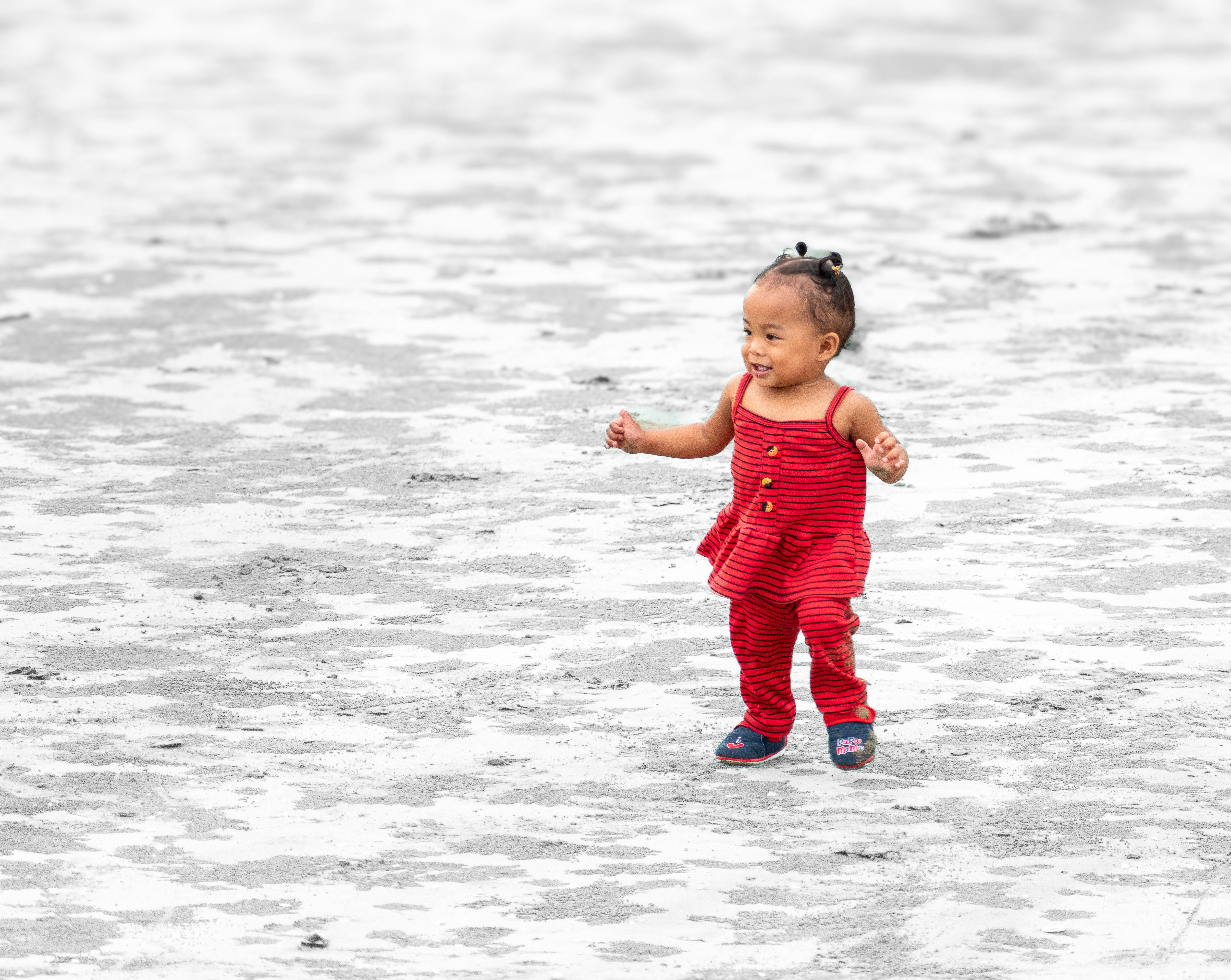 Smiling Toddler in Red Outfit on Outdoor Background · Free Stock Photo