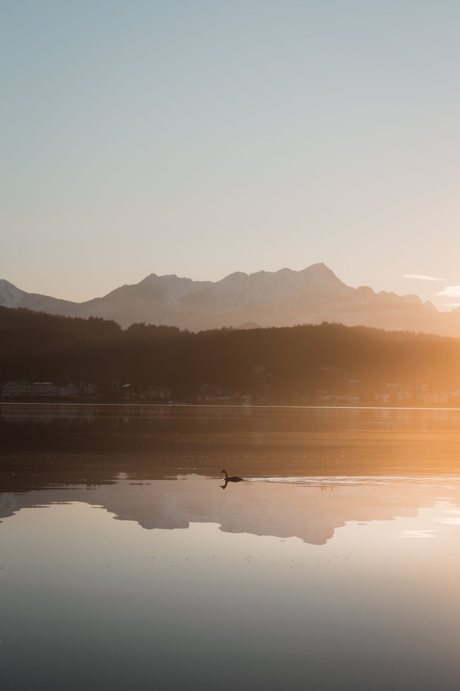 Tranquil Sunset Over Mountain Lake · Free Stock Photo
