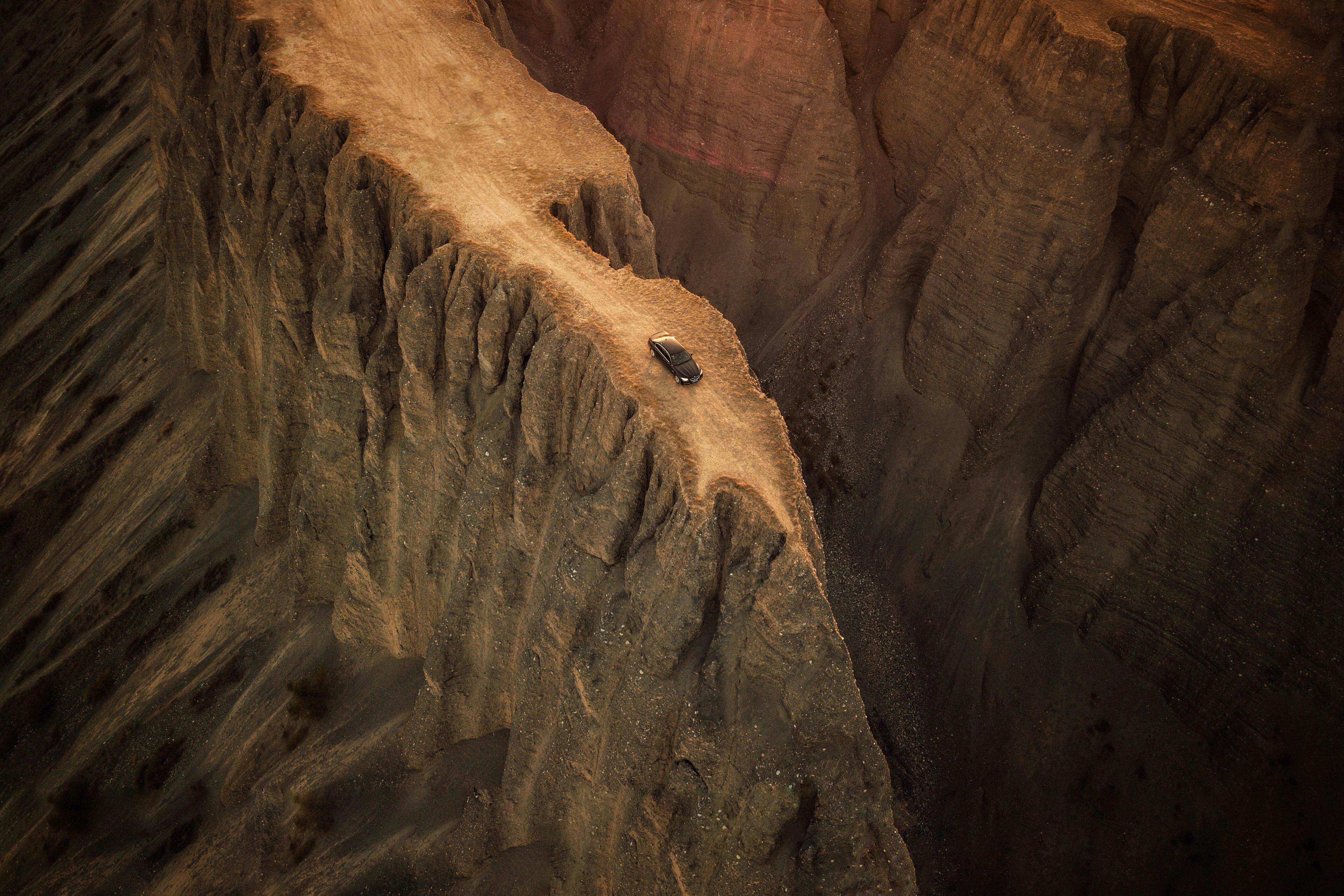 aerial photo of car near cliff