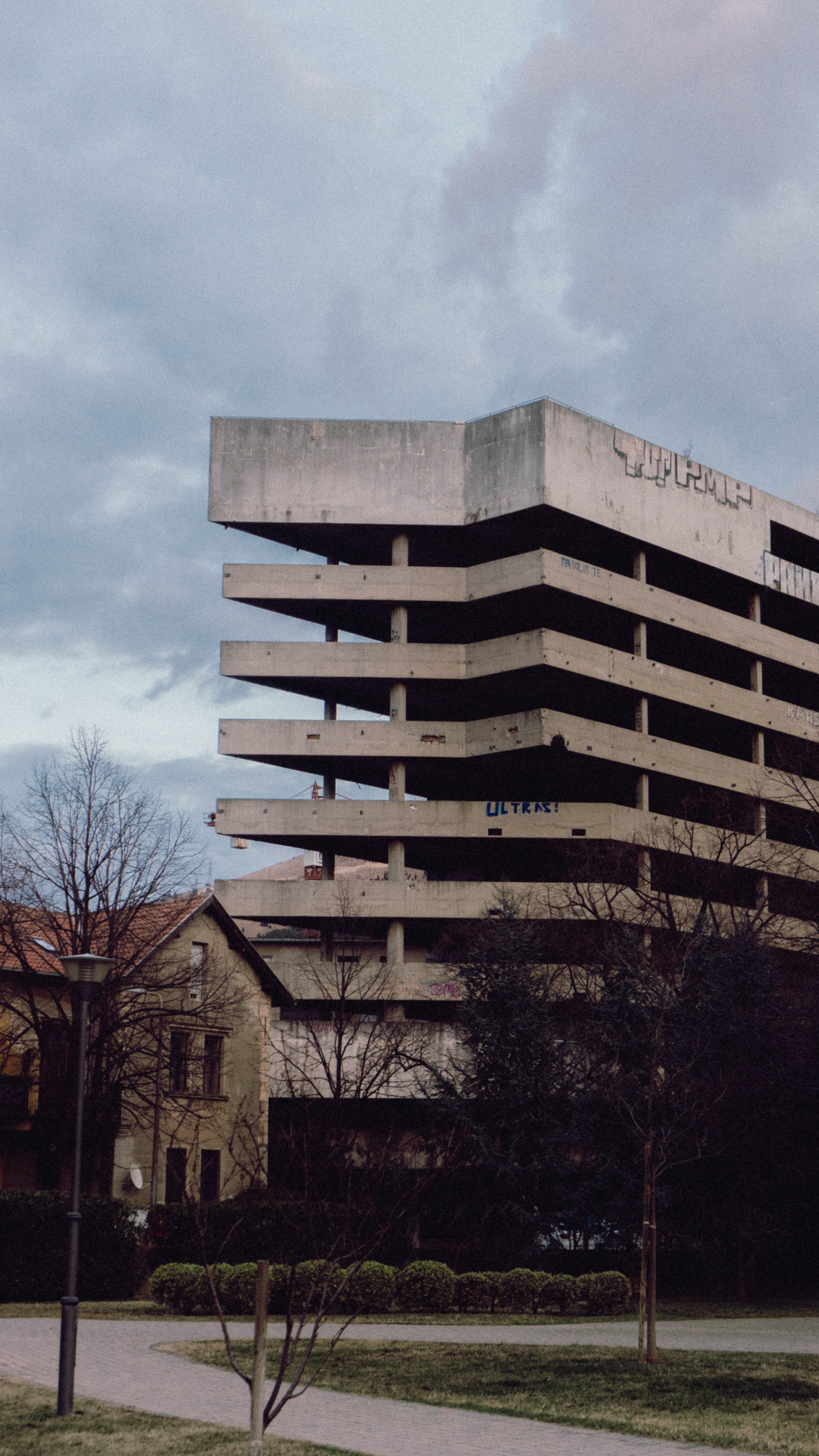 Abandoned brutalist building in urban park