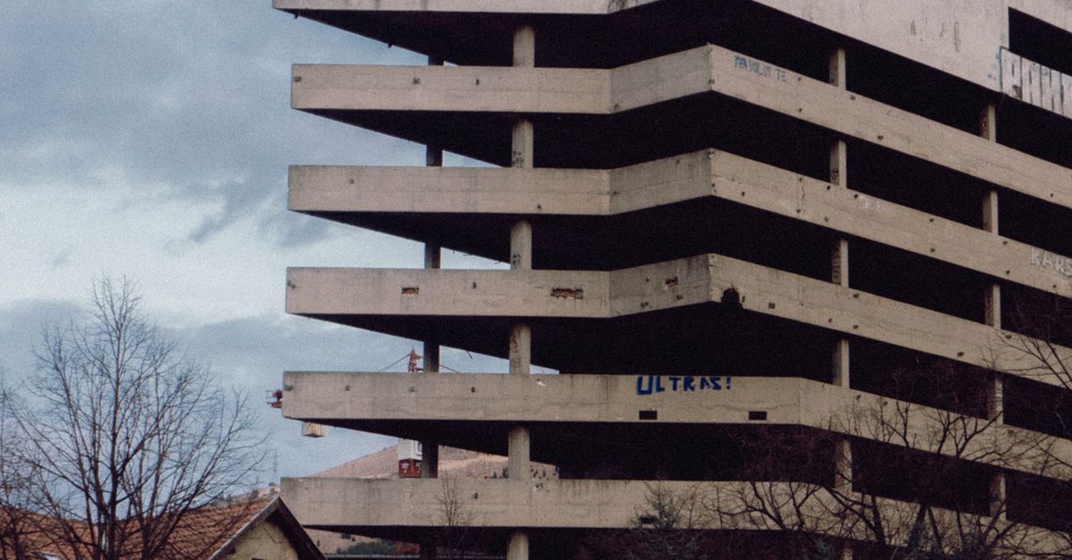 Austere Building Abandoned Brutalist Building in Urban Park Setting · Free Stock Photo