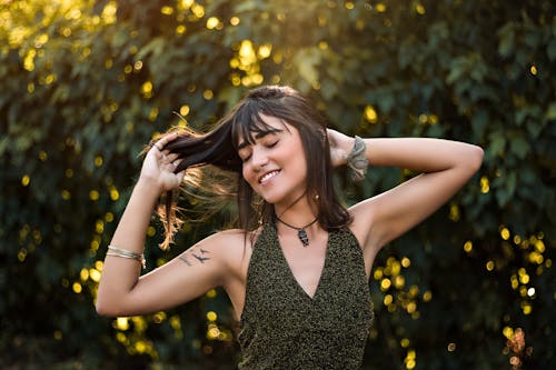 Free Woman Raising Her Both Arms Stock Photo