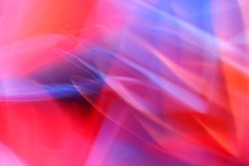 Free A colorful abstract background of red and blue hues, showcasing dynamic motion and energy. Stock Photo