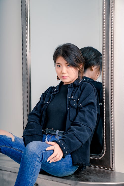 Woman Leaning on Mirror