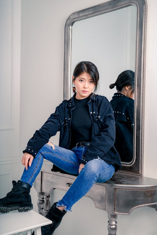 Woman Sitting on Vanity Table